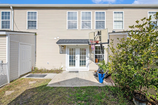 back of property featuring french doors and a patio