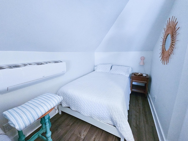 837 Club Cottage Rd, Edisto Island, SC 29438 - bedroom featuring wood finished floors, lofted ceiling, and a wall unit AC