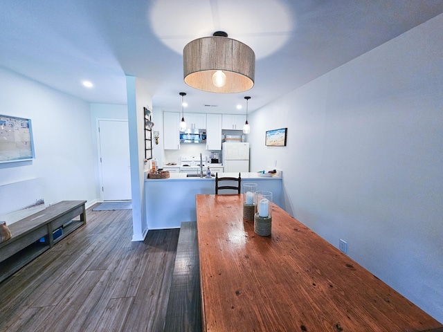 837 Club Cottage Rd, Edisto Island, SC 29438 - dining area with dark wood-type flooring and recessed lighting