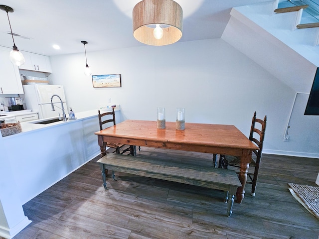 837 Club Cottage Rd, Edisto Island, SC 29438 - dining space featuring dark wood finished floors and stairway