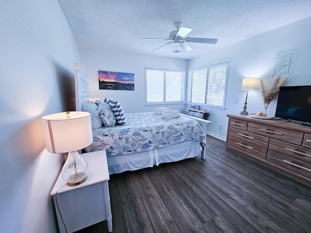 837 Club Cottage Rd, Edisto Island, SC 29438 - bedroom with a textured ceiling, dark wood-type flooring, and a ceiling fan