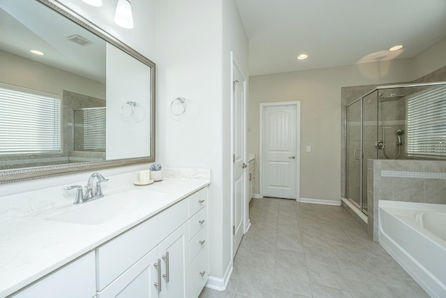 bathroom with vanity, separate shower and tub, and tile patterned flooring