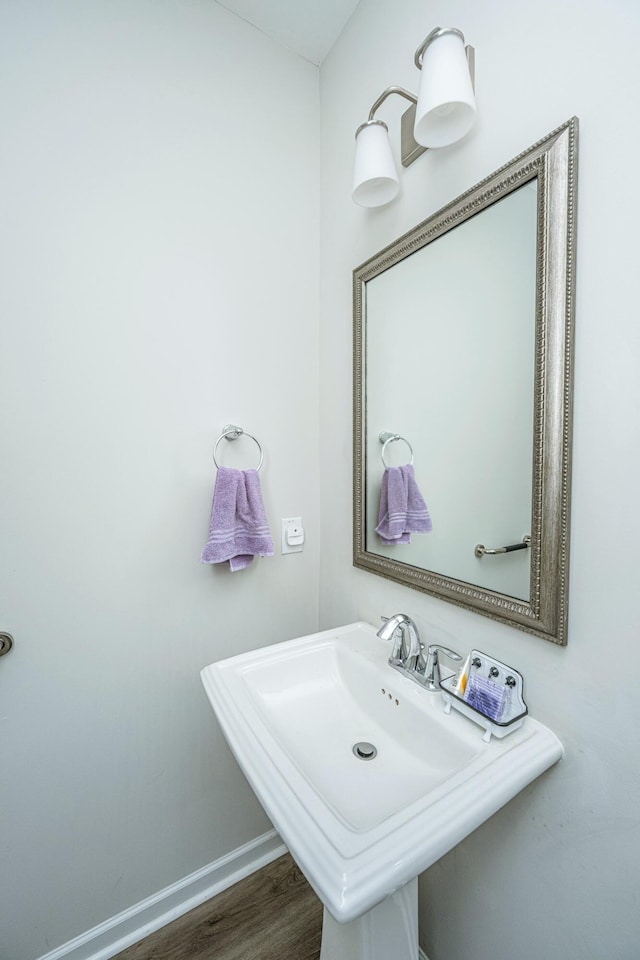 bathroom featuring sink and hardwood / wood-style flooring