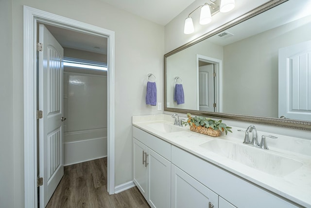 bathroom featuring wood-type flooring and vanity