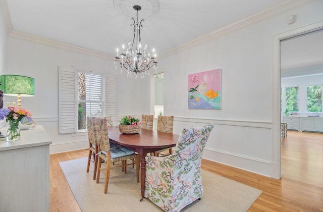 62 Eastlake Rd, Mount Pleasant, SC 29464 - dining area with light wood-style floors, crown molding, and a chandelier