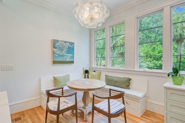62 Eastlake Rd, Mount Pleasant, SC 29464 - dining space featuring breakfast area, healthy amount of natural light, light wood finished floors, ornamental molding, and baseboards