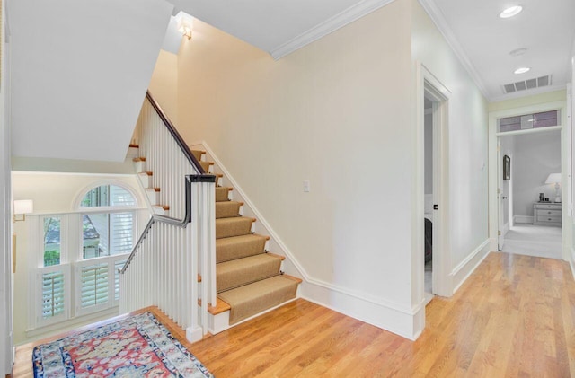 62 Eastlake Rd, Mount Pleasant, SC 29464 - stairway featuring wood finished floors, crown molding, baseboards, and recessed lighting