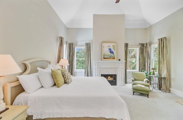 62 Eastlake Rd, Mount Pleasant, SC 29464 - bedroom with carpet, a premium fireplace, high vaulted ceiling, baseboards, and a ceiling fan