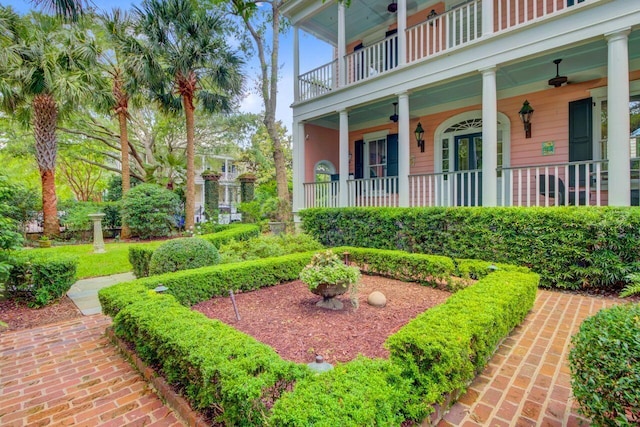62 Eastlake Rd, Mount Pleasant, SC 29464 - view of yard featuring a balcony, covered porch, and a ceiling fan