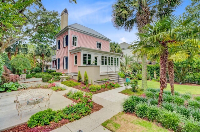 62 Eastlake Rd, Mount Pleasant, SC 29464 - view of side of home featuring a chimney