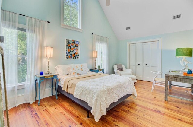 62 Eastlake Rd, Mount Pleasant, SC 29464 - bedroom with high vaulted ceiling, light wood finished floors, a closet, and ceiling fan