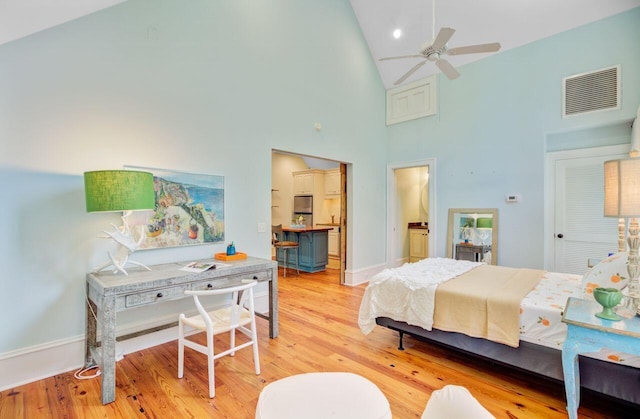 62 Eastlake Rd, Mount Pleasant, SC 29464 - bedroom featuring high vaulted ceiling, light wood-type flooring, baseboards, and ensuite bath