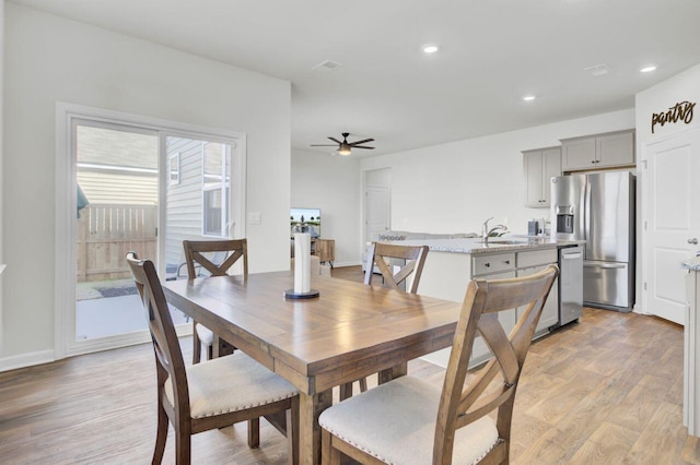 dining room featuring light wood-style flooring, recessed lighting, a ceiling fan, and visible vents