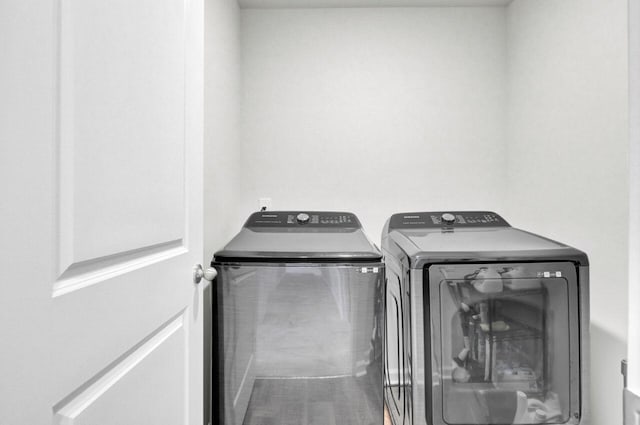 clothes washing area featuring laundry area and independent washer and dryer