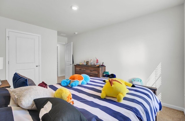 carpeted bedroom with baseboards