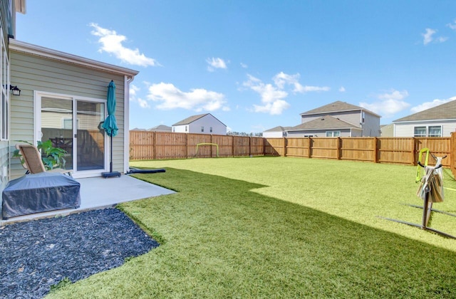 view of yard featuring a patio and a fenced backyard