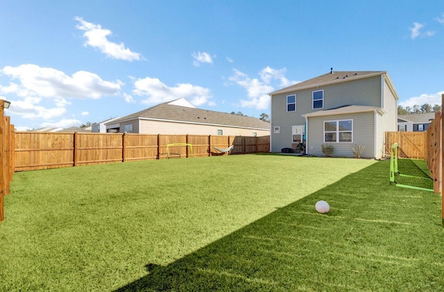 view of yard with a fenced backyard