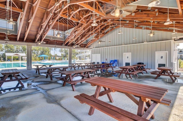 exterior space featuring high vaulted ceiling