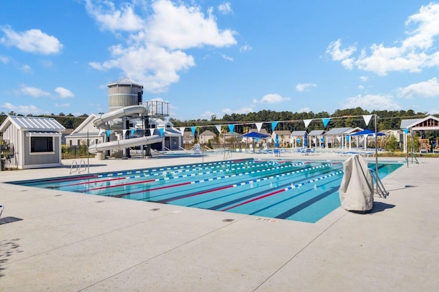 community pool with a patio area