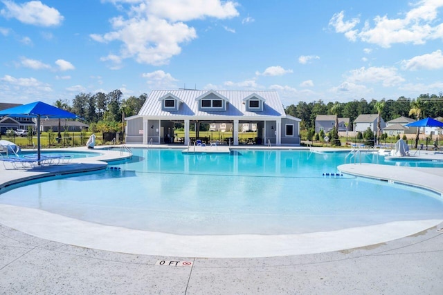 pool featuring a patio area and fence