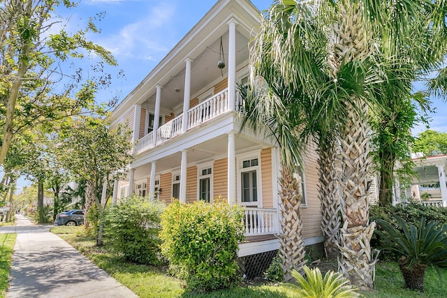 exterior space featuring a porch and a balcony