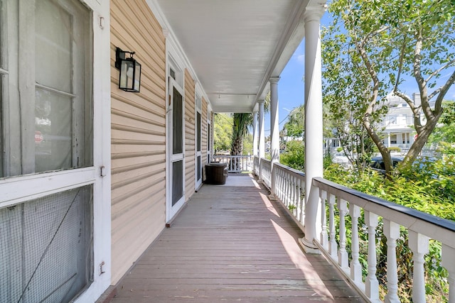 wooden terrace featuring a porch