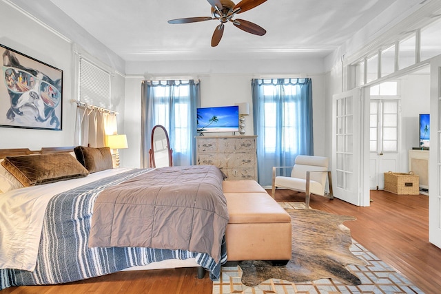 bedroom featuring wood finished floors and ceiling fan