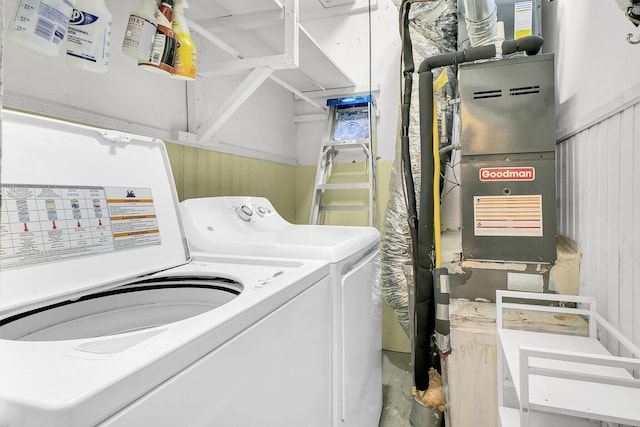 clothes washing area featuring washer and clothes dryer and laundry area