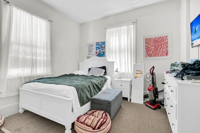 bedroom with light colored carpet