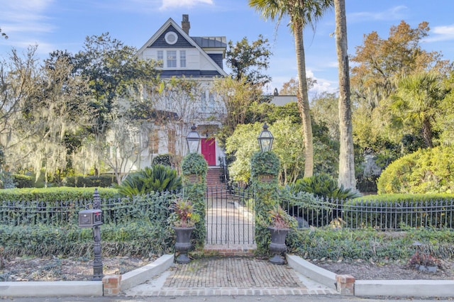 208 Sumter Ave, Summerville, SC 29483 - view of front of house featuring fence and a chimney