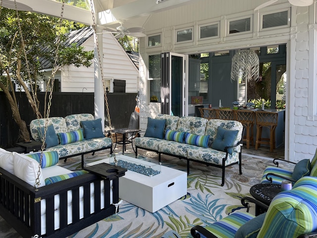 view of patio / terrace with an outdoor living space with a fire pit