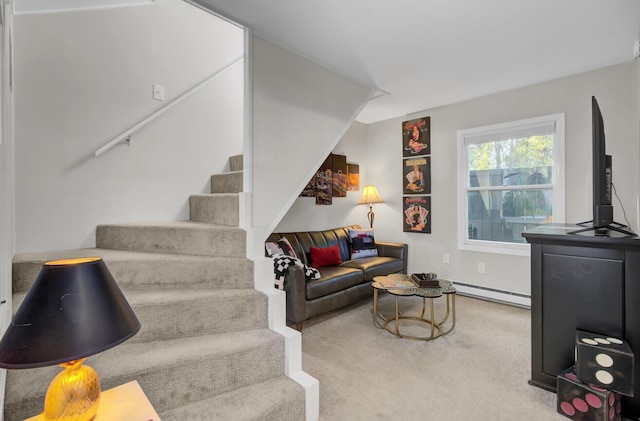 living room featuring light carpet and baseboard heating