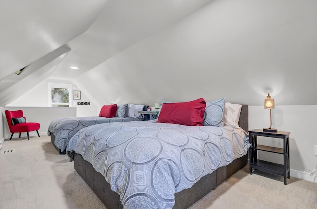 carpeted bedroom with vaulted ceiling