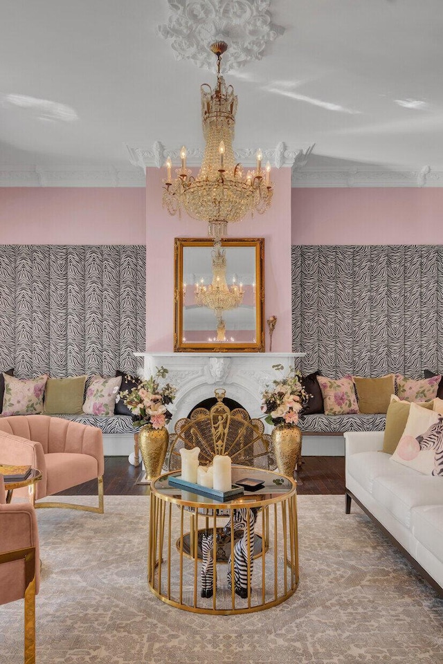 living room with hardwood / wood-style floors and an inviting chandelier