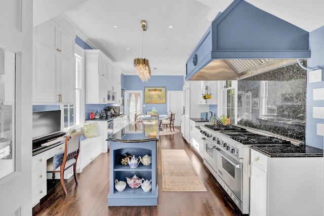 kitchen featuring decorative light fixtures, a healthy amount of sunlight, double oven range, and white cabinetry