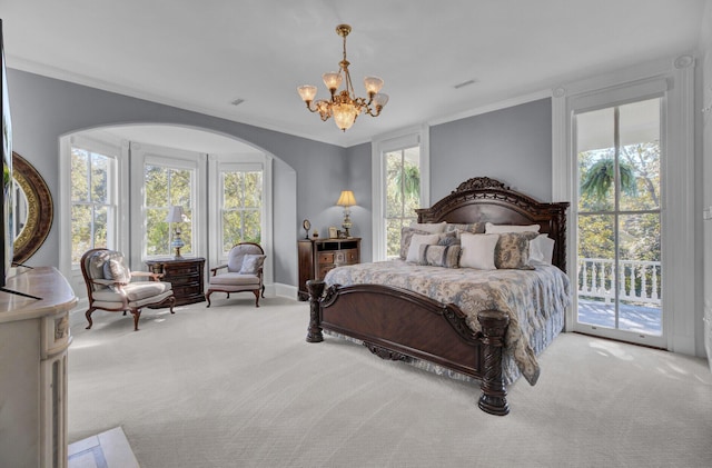 bedroom featuring access to exterior, carpet flooring, an inviting chandelier, and crown molding