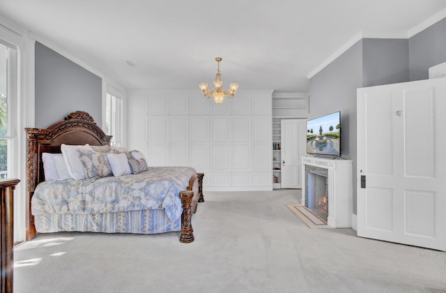 bedroom with a chandelier, light colored carpet, and ornamental molding