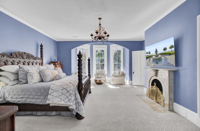 bedroom with carpet, an inviting chandelier, and ornamental molding