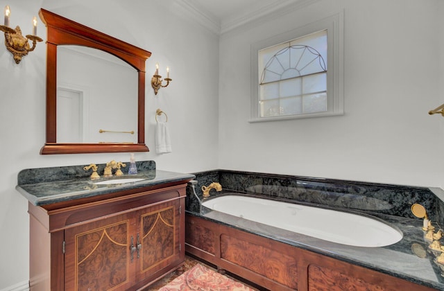 bathroom with vanity, crown molding, and a tub