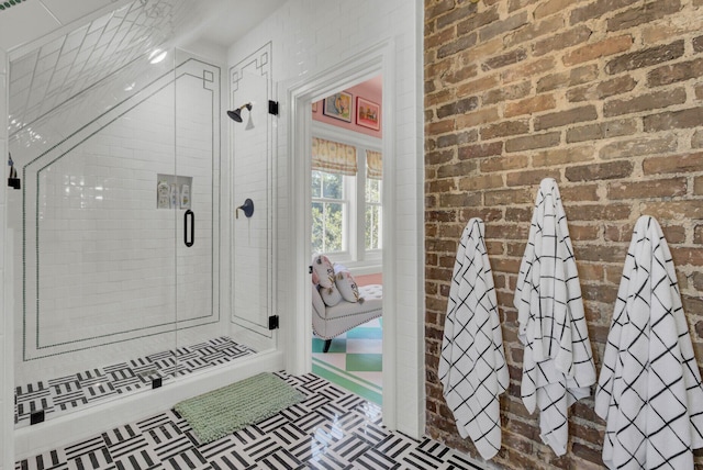 bathroom with walk in shower and brick wall