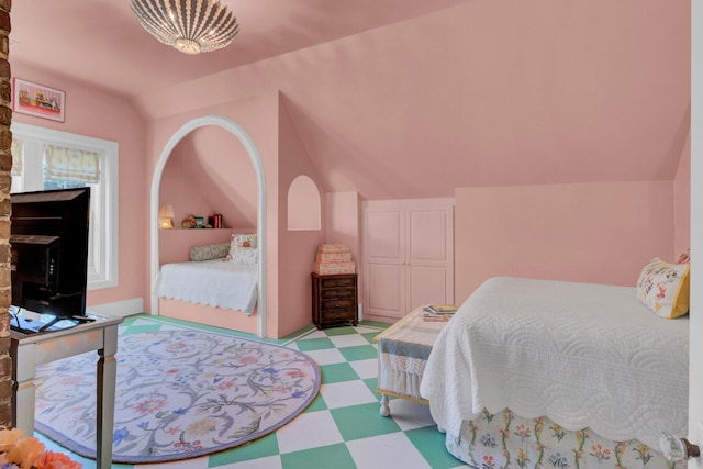 bedroom featuring lofted ceiling