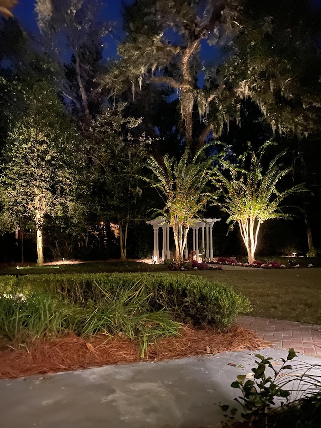 view of yard at twilight