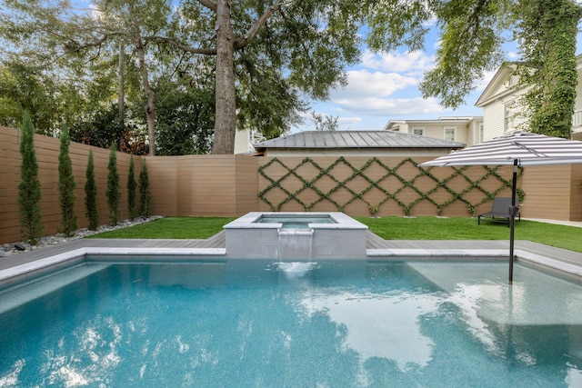 view of pool featuring a fenced backyard, a fenced in pool, a lawn, and an in ground hot tub