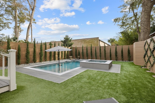 view of swimming pool with a fenced in pool, a fenced backyard, a yard, and an in ground hot tub