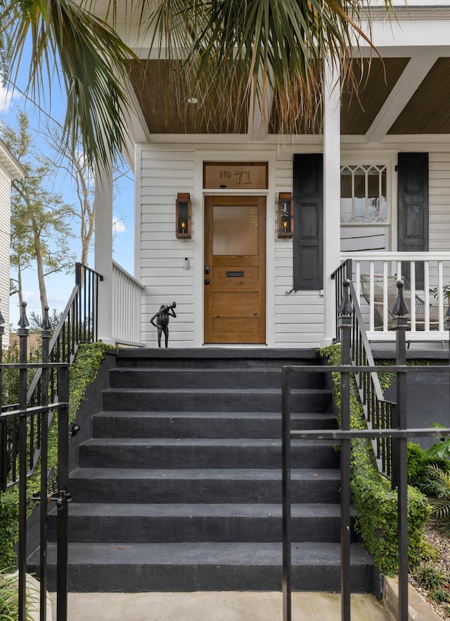 doorway to property with a porch