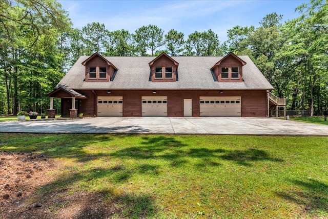 6840 Early Jersey Rd, Meggett, SC 29449 - view of front facade featuring driveway and a detached garage