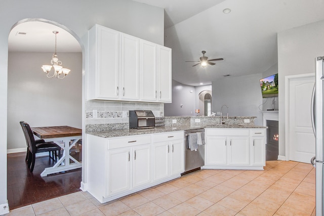 3639 Pimmit Pl, Ladson, SC 29456 - kitchen with stainless steel appliances, arched walkways, a sink, ceiling fan, and white cabinets