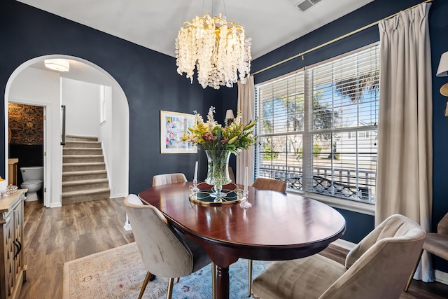 dining room featuring light hardwood / wood-style floors and a chandelier