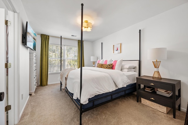 bedroom with light colored carpet