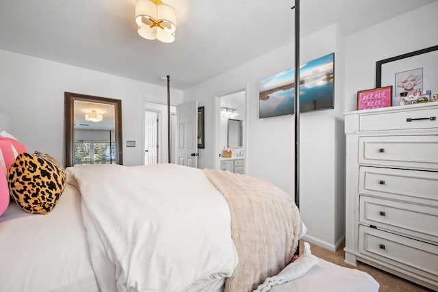 carpeted bedroom with ensuite bath